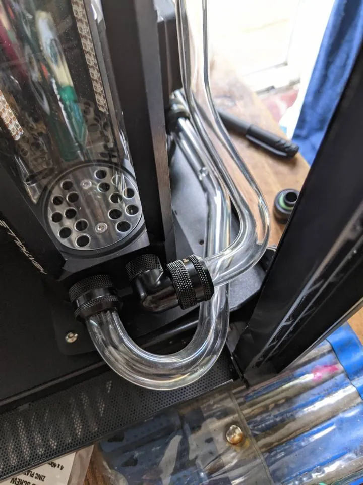 Acrylic tubing bent, cut and installed to CPU loop pump-reservoir