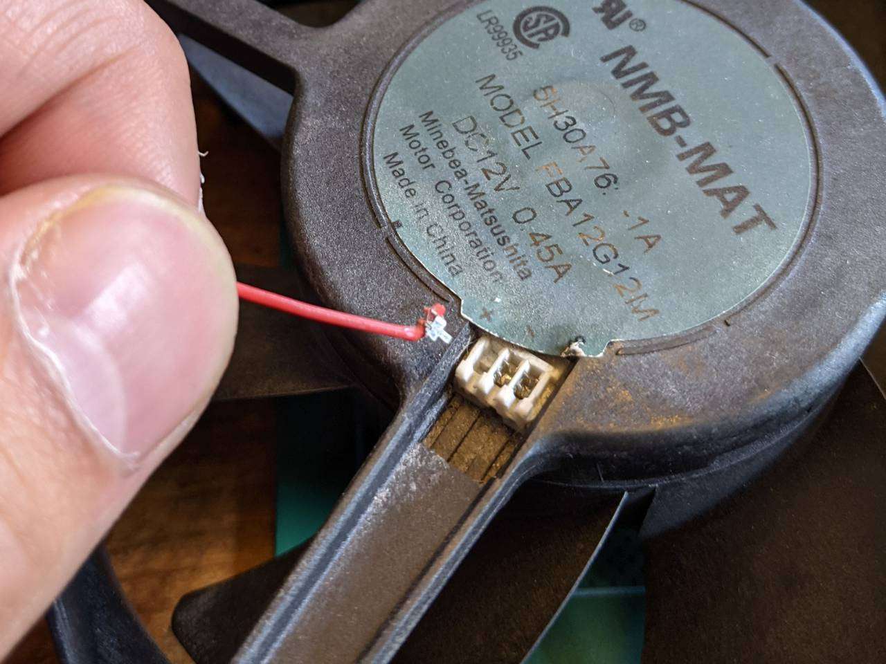 Fan connector, terminal ripped out, close-up