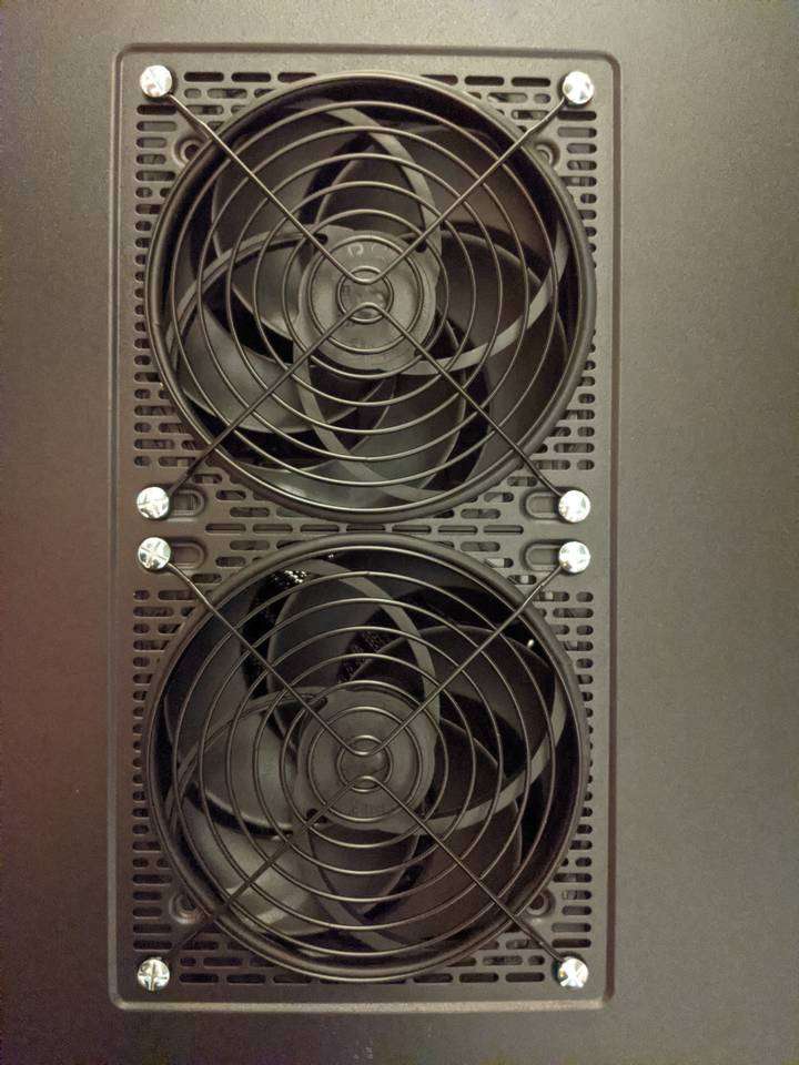 Rear panel with fans and fan grills installed