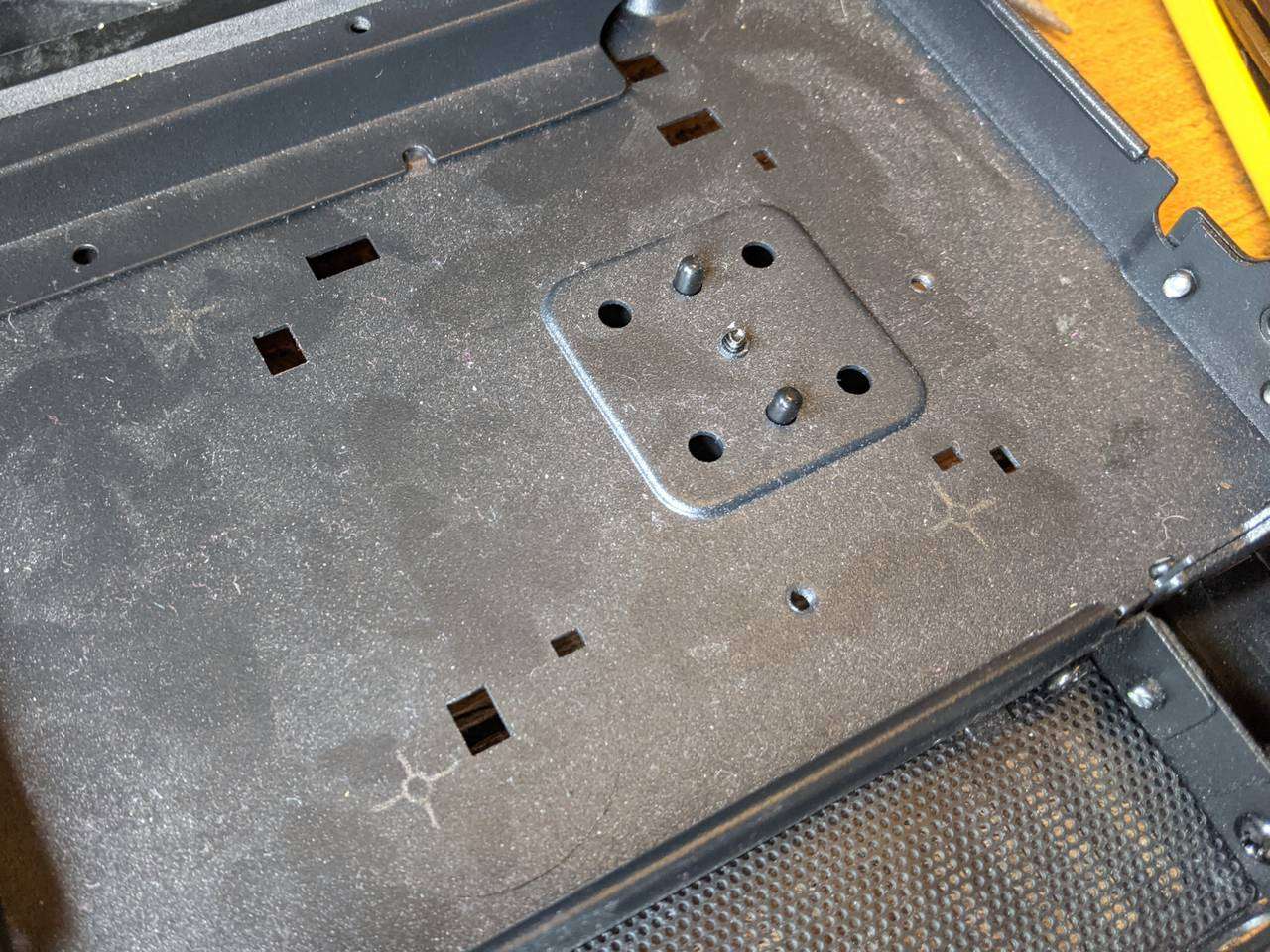 Marked out screw holes for CPU loop's pump-reservoir
